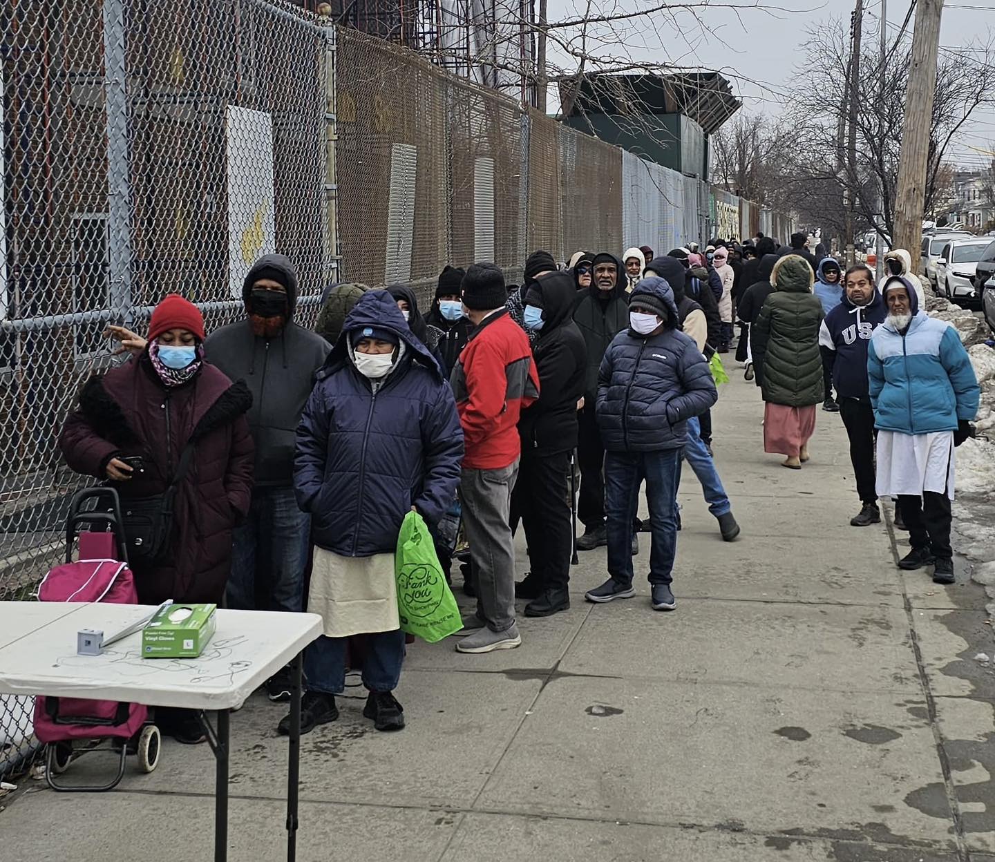 Community members waiting during an APAG Cares food drive
