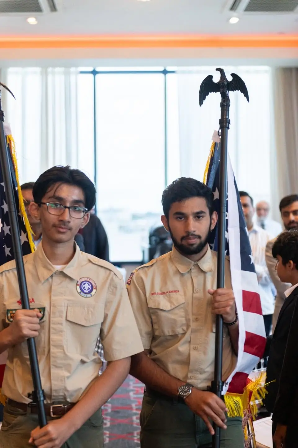 Youth holding flags during an America at 250 community event