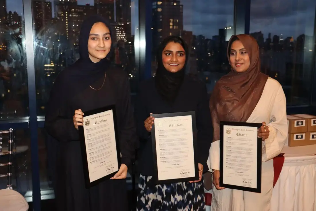 Young women holding civic citation certificates during America at 250