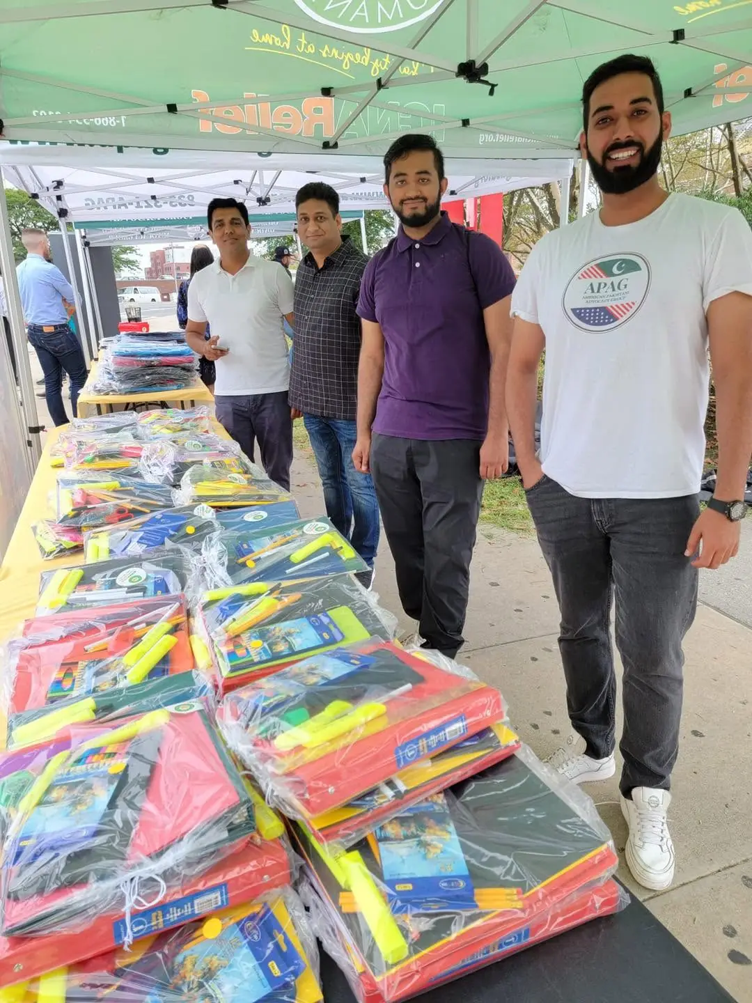 School supplies organized on tables during an APAG Cares back-to-school drive