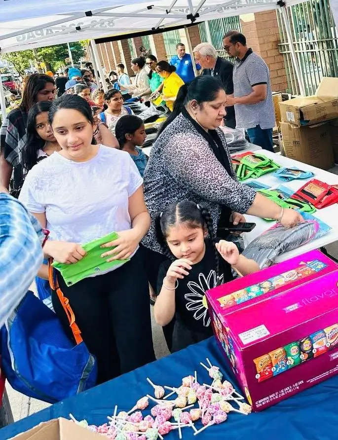 Children and families receiving school supplies