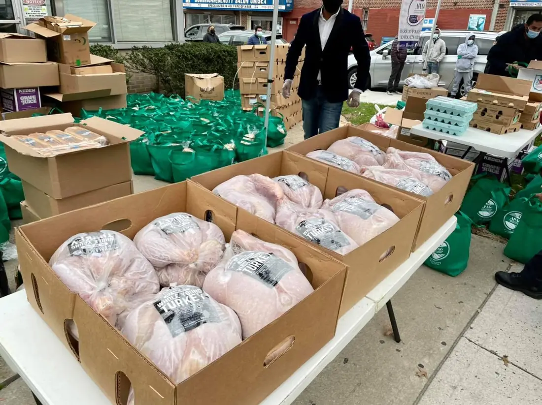 Halal turkey boxes and food bags prepared for an APAG Cares Thanksgiving distribution