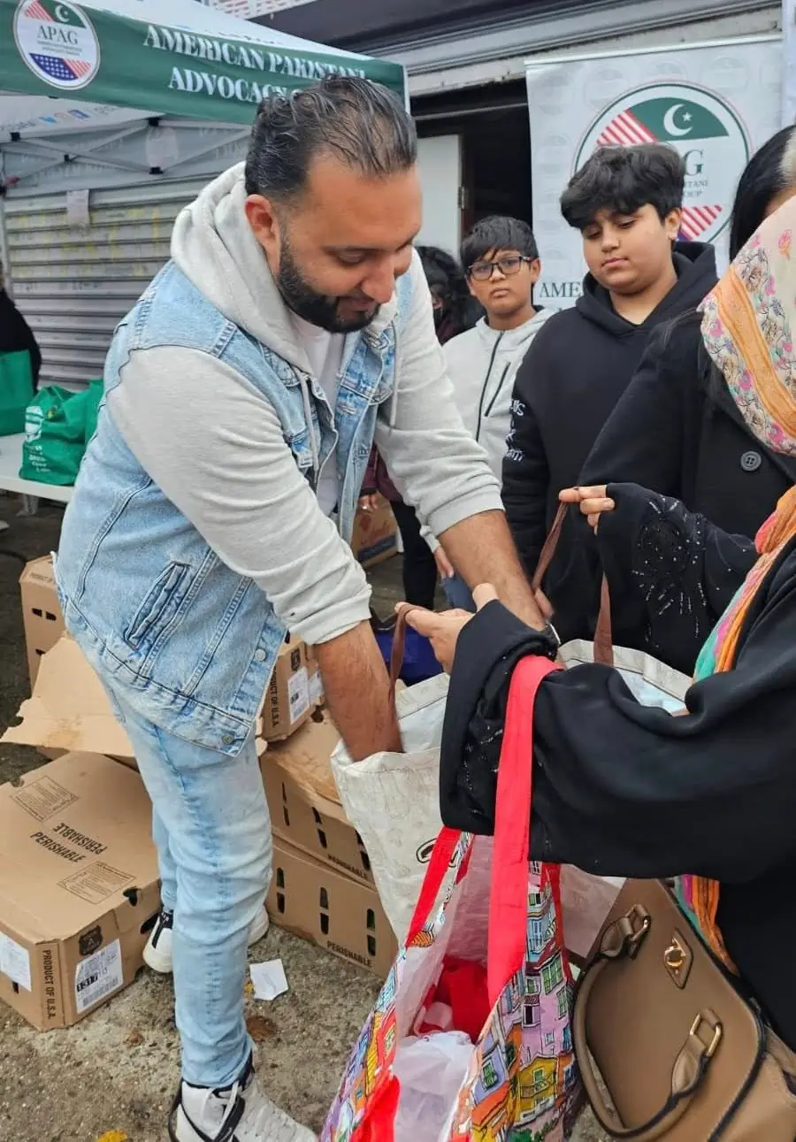 APAG Cares Thanksgiving distribution with food and volunteers